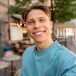 Gabriel medium-shot-smiley-man-posing-outdoors-min