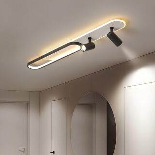 Plafonnier spot en double ellipses illuminées superposées accompagné de deux spots lumineux excentrés sur un plafond blanc